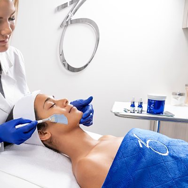 zo skin health patient receiving chemical peel treatment