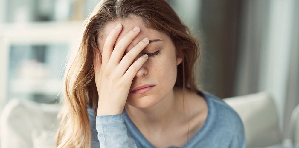 young woman who appears to be tired or exhausted young woman who appears to be tired or exhausted