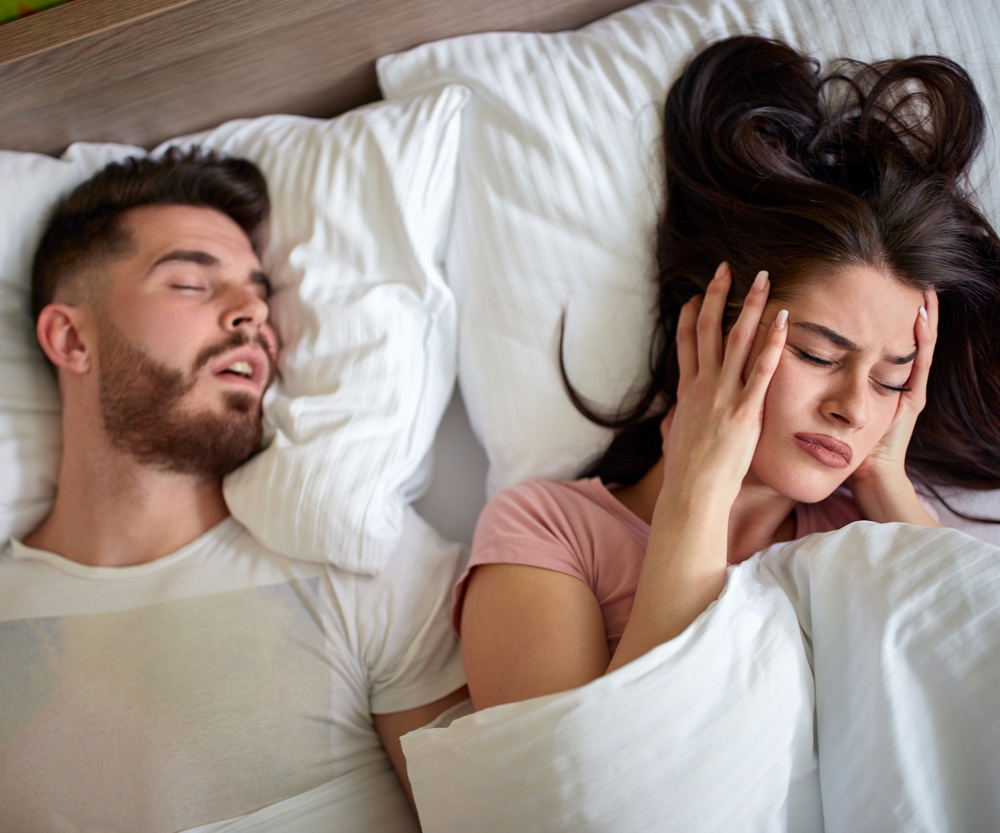 Women in bed with snoring husband Women in bed with snoring husband
