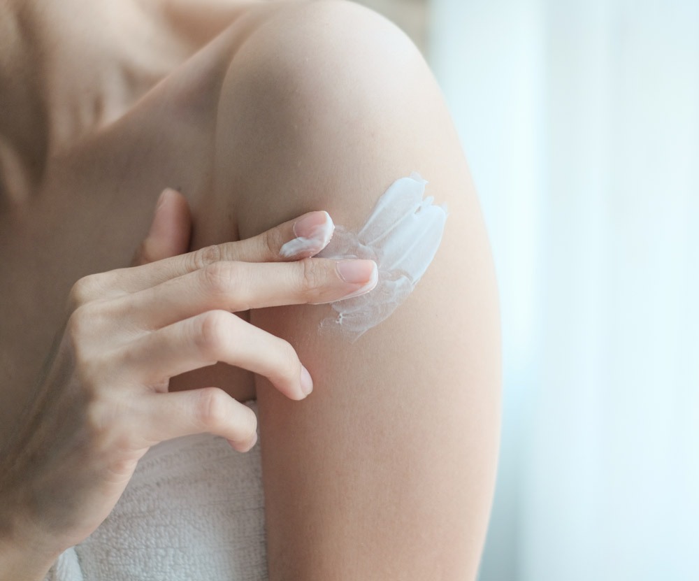 Woman applying arm cream,lotion , Hygiene skin body care concept.